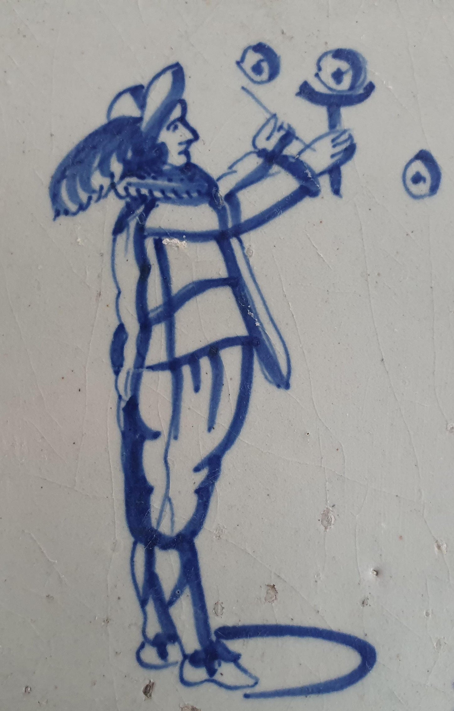 17th Century Delft Tile: Child Blowing Bubbles, Blue Ox-Head Motif