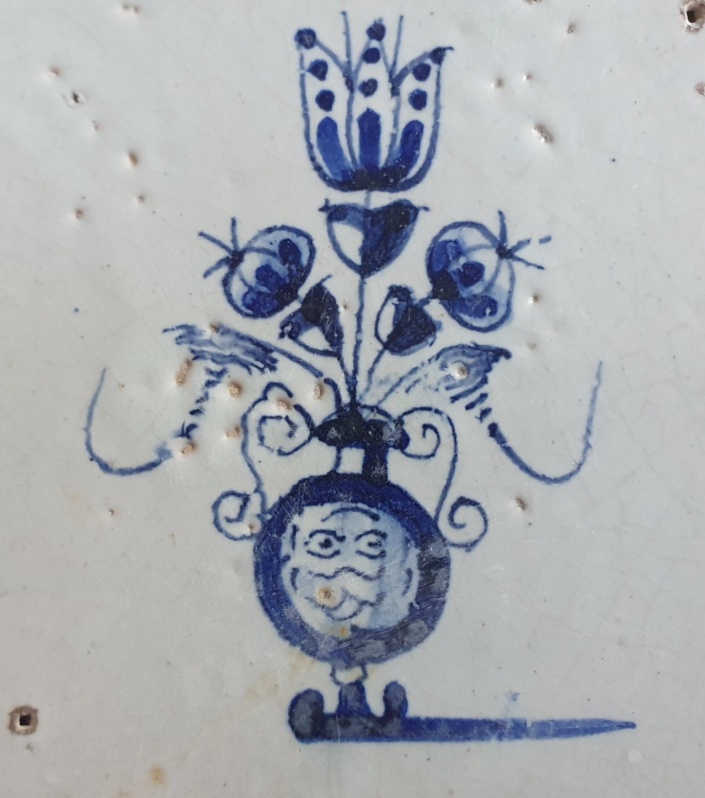 17th century Antique Dutch Tile flower with oxhead corner motive delft blue holland tile