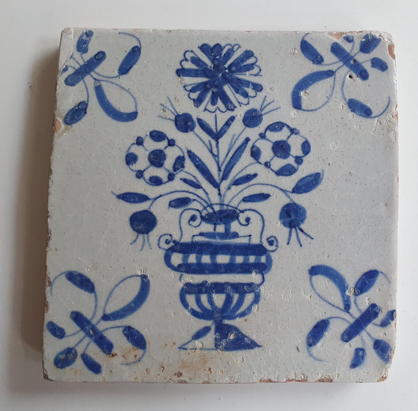 17th century Antique Dutch Tile flower with lilyhead corner motive delft blue holland tile