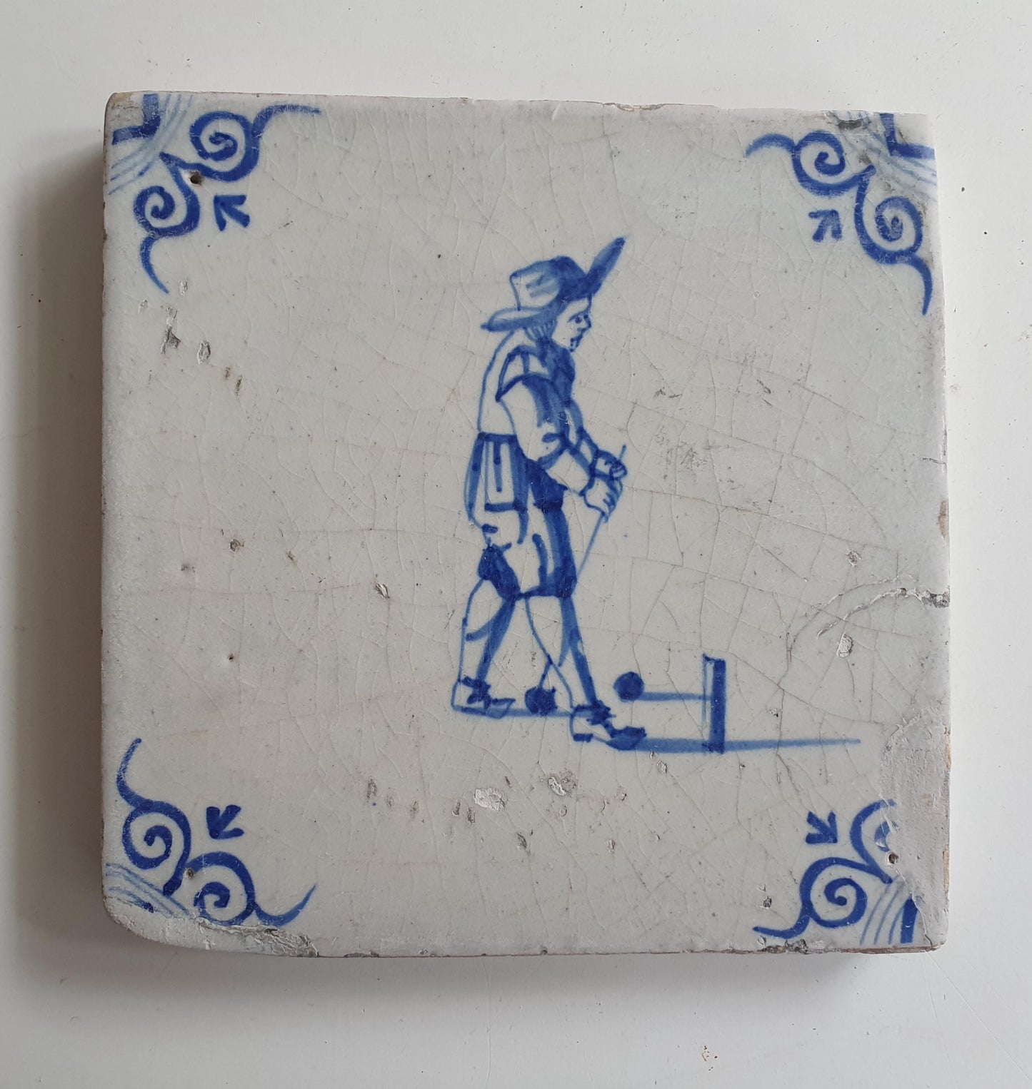 17th Delft tile was  made around 1650, with a golf player