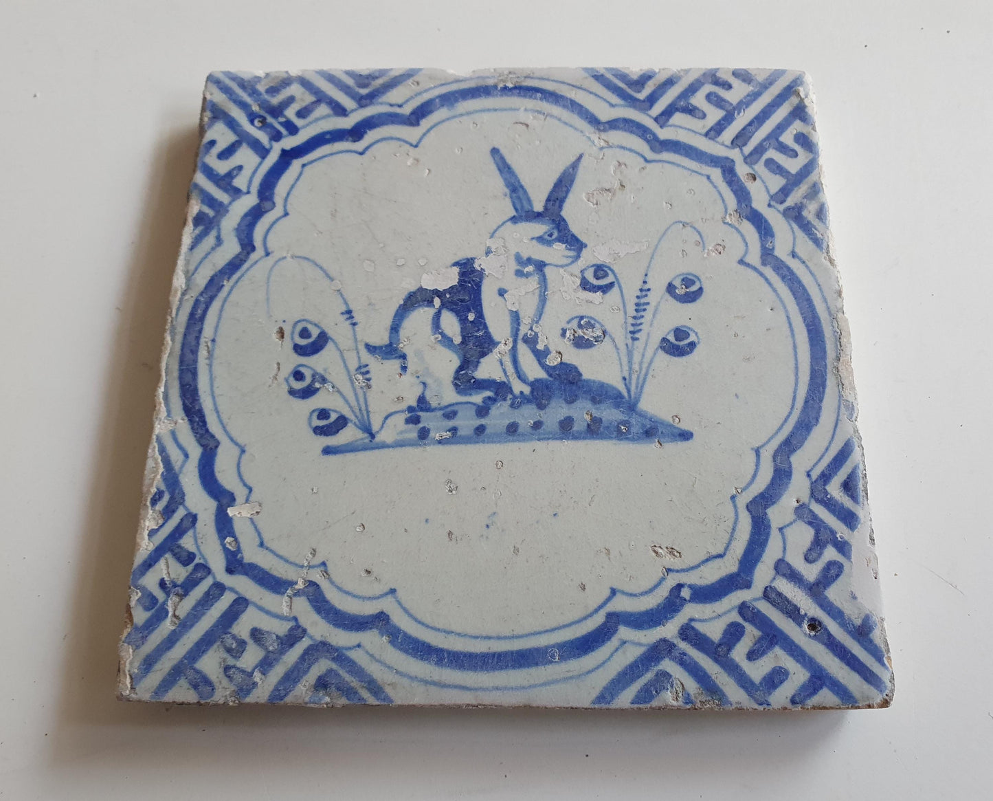 17th Antique Dutch Delft Blue Tile - rabbit with a meander shape - Dated around 1640