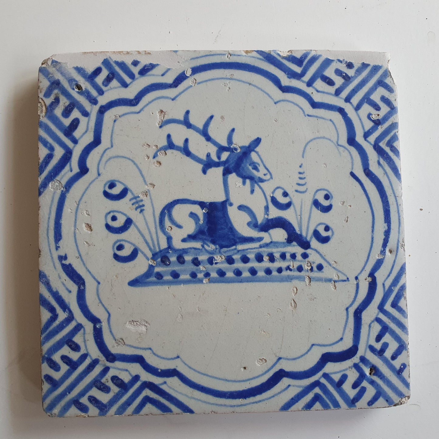 17th Antique Dutch Delft Blue Tile - deer with a meander shape - Dated around 1640