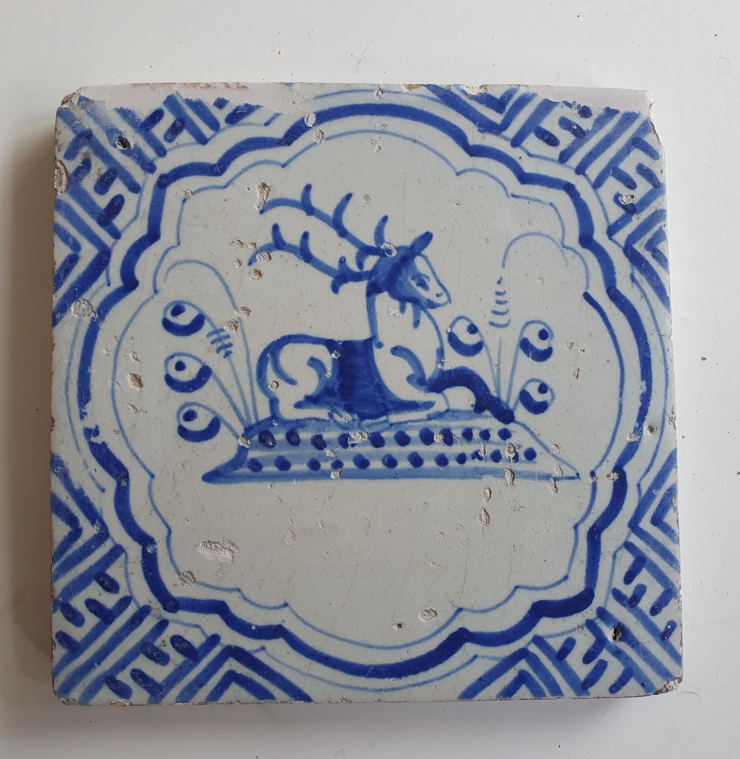 17th Antique Dutch Delft Blue Tile - deer with a meander shape - Dated around 1640