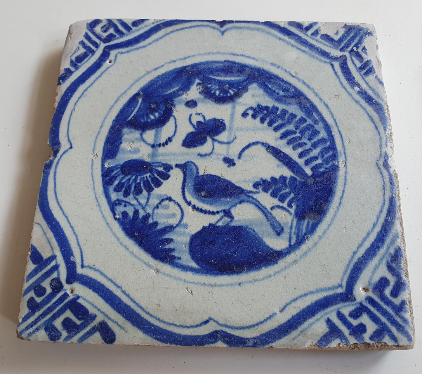 17th Antique Dutch Delft Blue Tile - Chinese garden with a meander shape - Dated around 1640