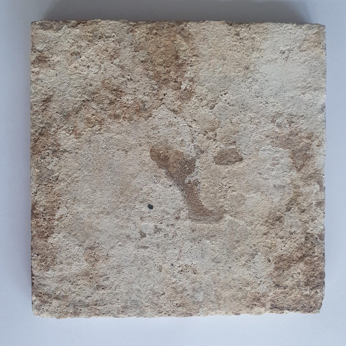 This antique Delft tile, dating from around 1640, depicts Cupid with stick.
