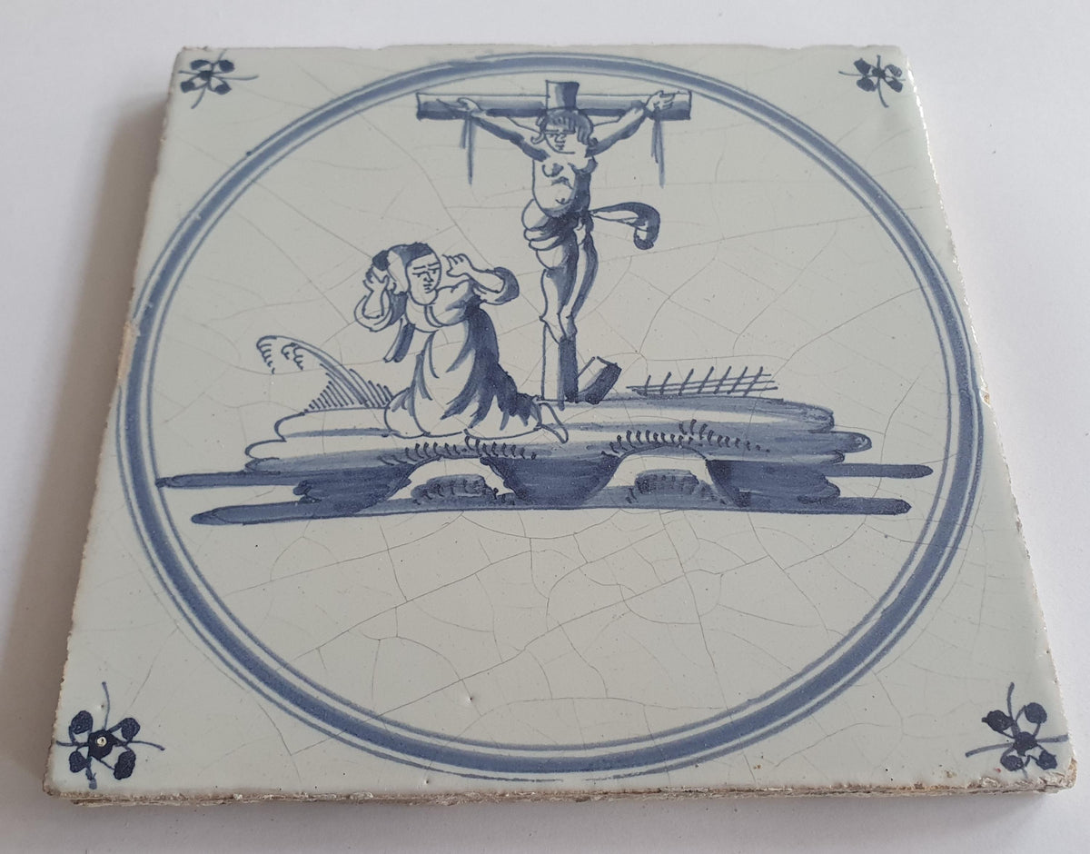 This original 18th century (c. 1740) Delft tile depicts the crucifixtion of Jesus Christ.