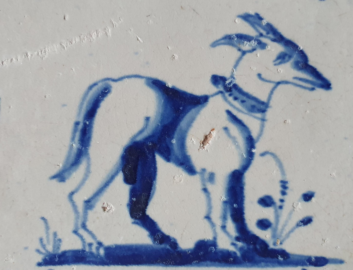 17th Century Dutch Delft Tile, Dog with Lily Corner Motive