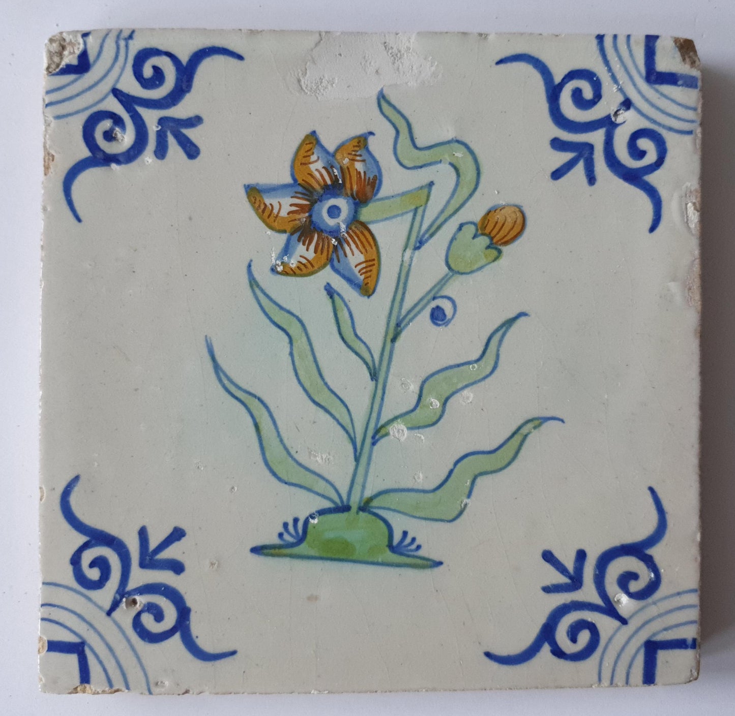 Antique Delft Tile - Polychrome Flower, Oxhead Motifs, c. 1630