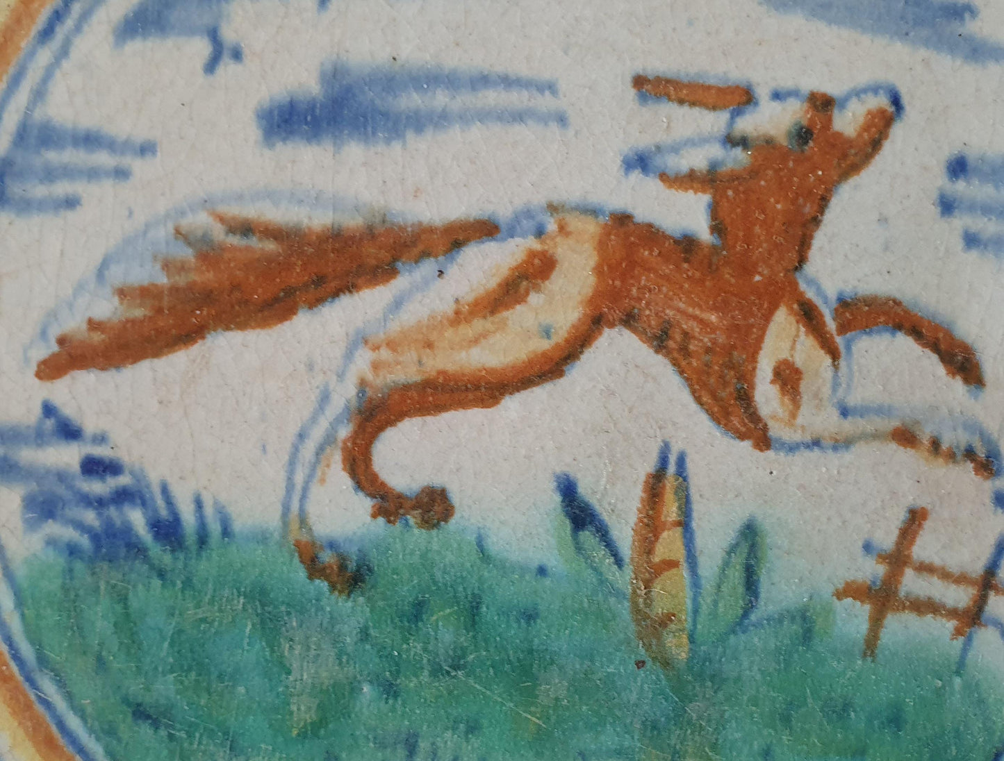This rare Delft tile with fox .                around 1620