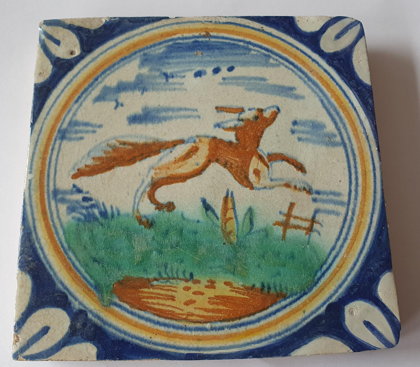 This rare Delft tile with fox .                around 1620