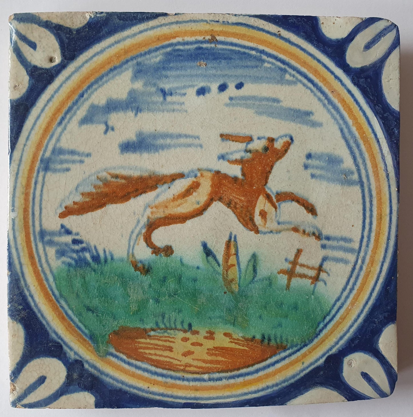 This rare Delft tile with fox .                around 1620