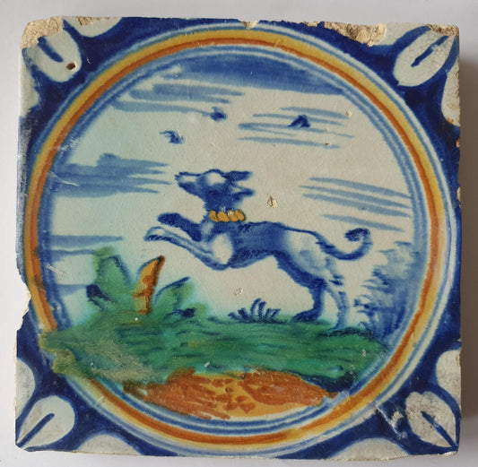 This rare Delft tile with dog .                around 1620