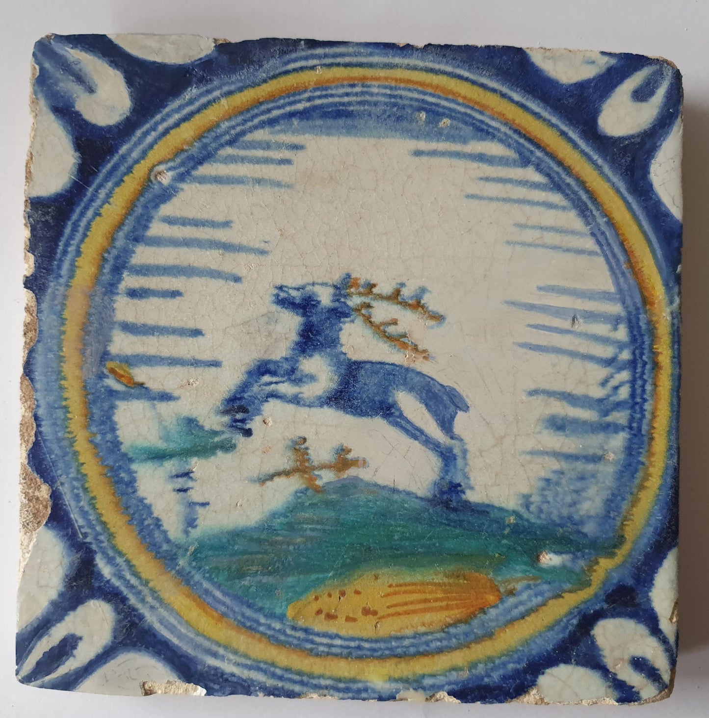 This rare Delft tile with deer .                around 1620