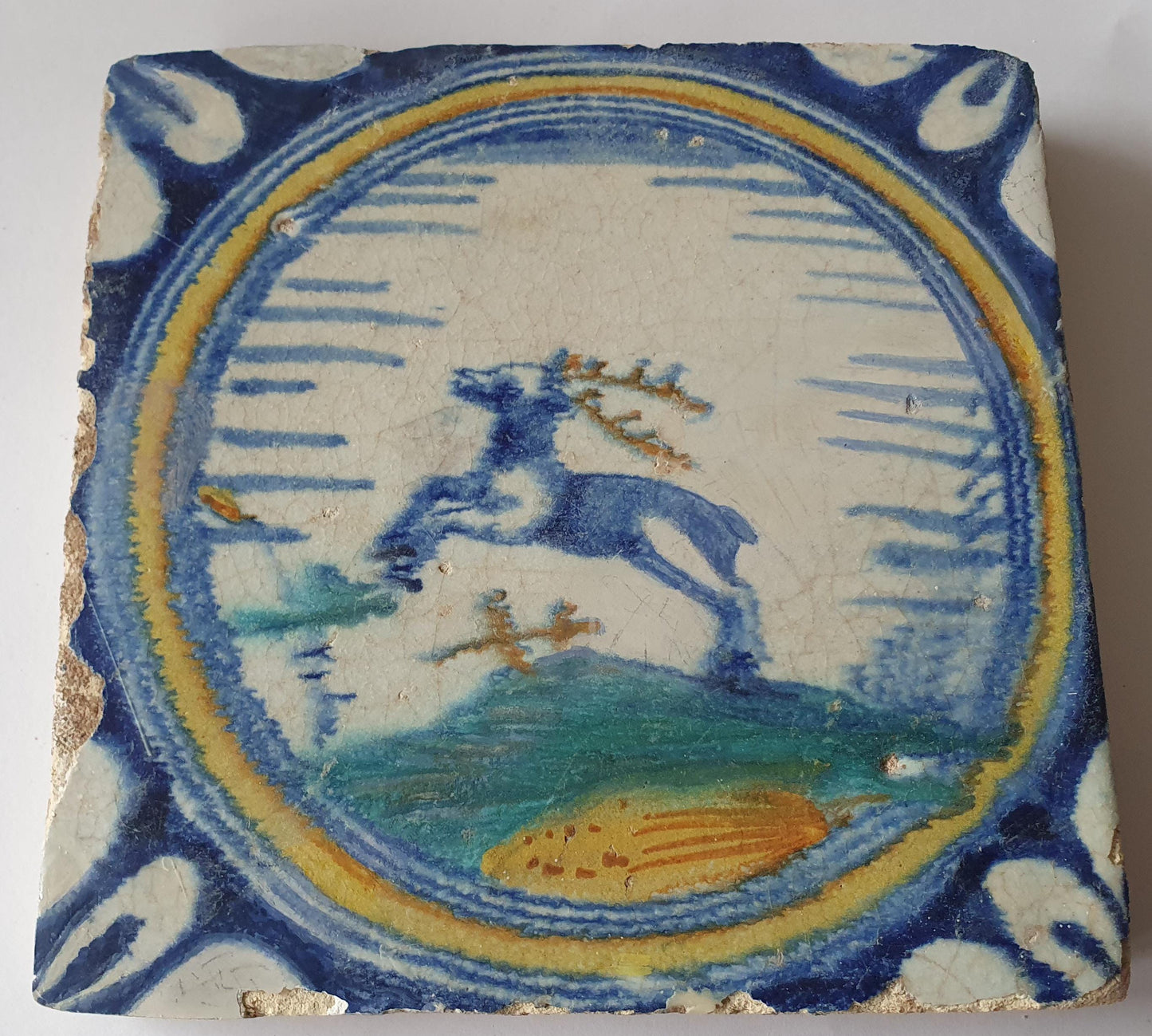 This rare Delft tile with deer .                around 1620