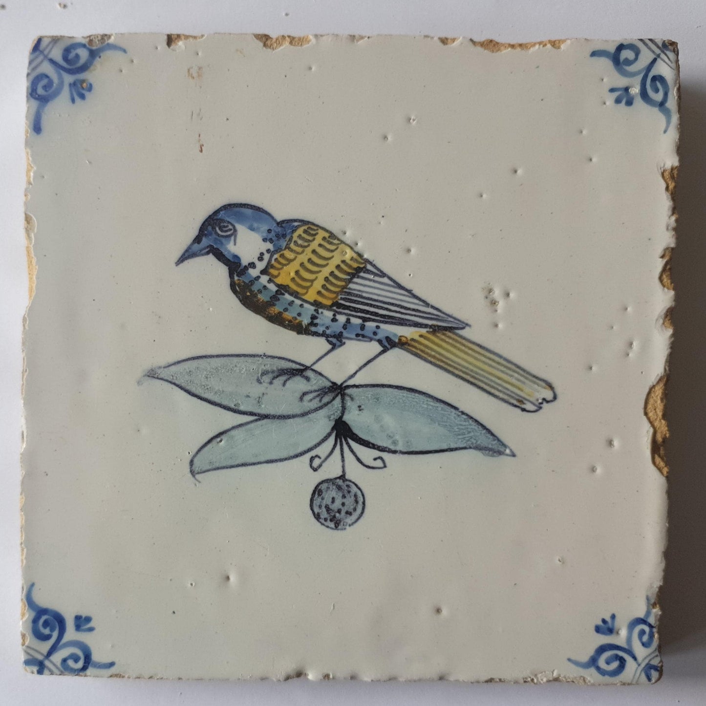 This 17th century Delft tile (c. 1640) depicts a polychrome  bird