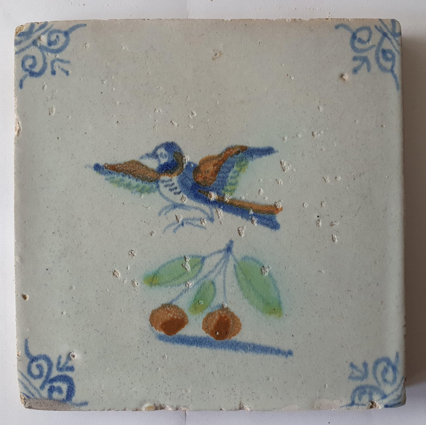 This 17th century Delft tile (c. 1640) depicts a polychrome  bird
