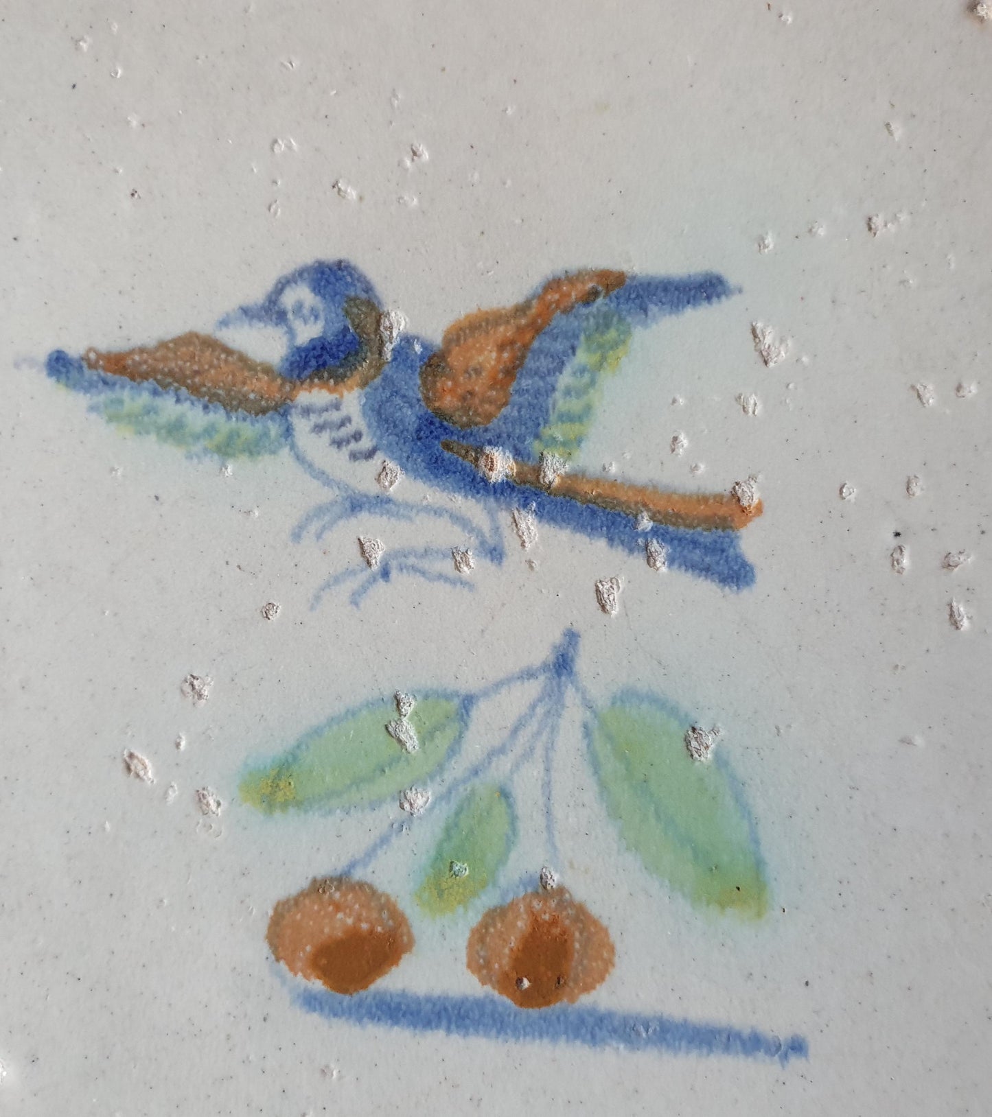 This 17th century Delft tile (c. 1640) depicts a polychrome  bird