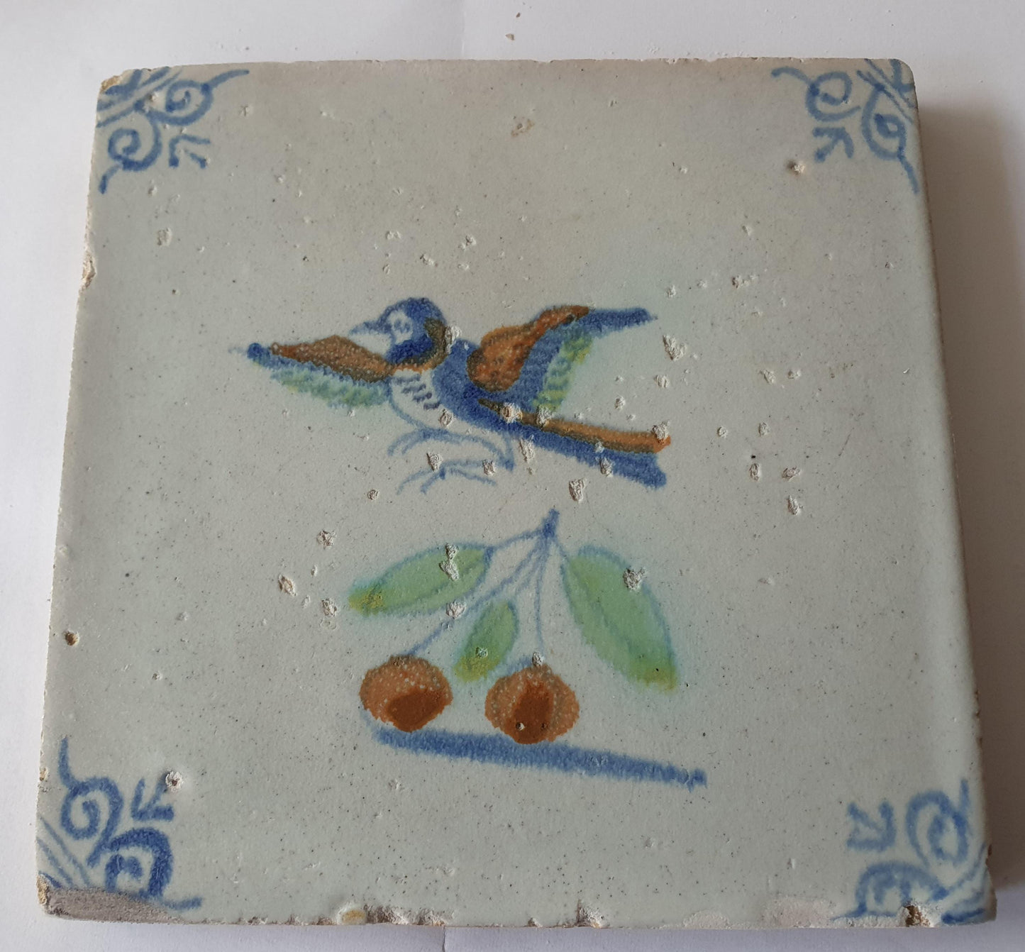 This 17th century Delft tile (c. 1640) depicts a polychrome  bird