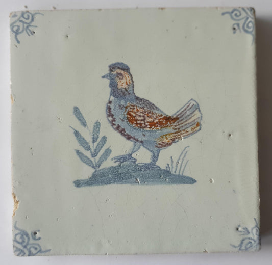 This antique Delft tile was made around 1650 and depicts a handsome rooster