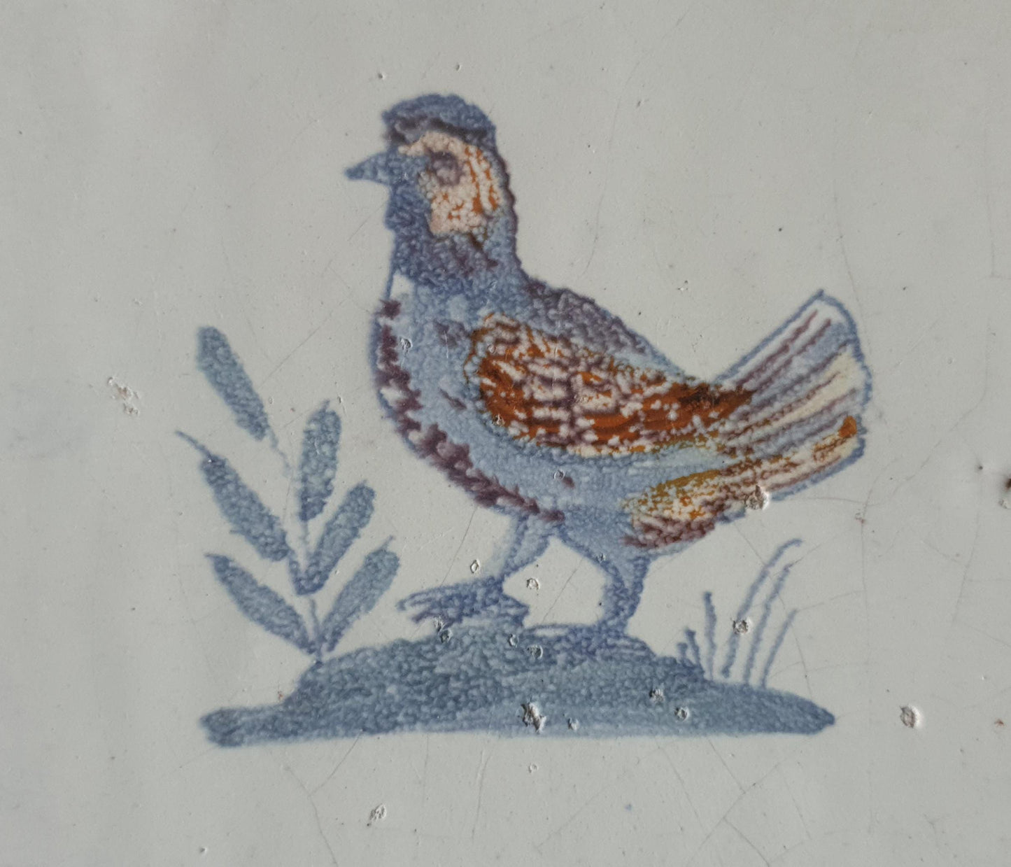 This antique Delft tile was made around 1650 and depicts a handsome rooster