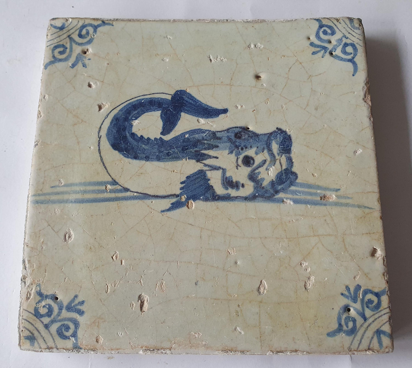 Antique Delft Tile – 17th Century Dutch Fish Design oxhead corner