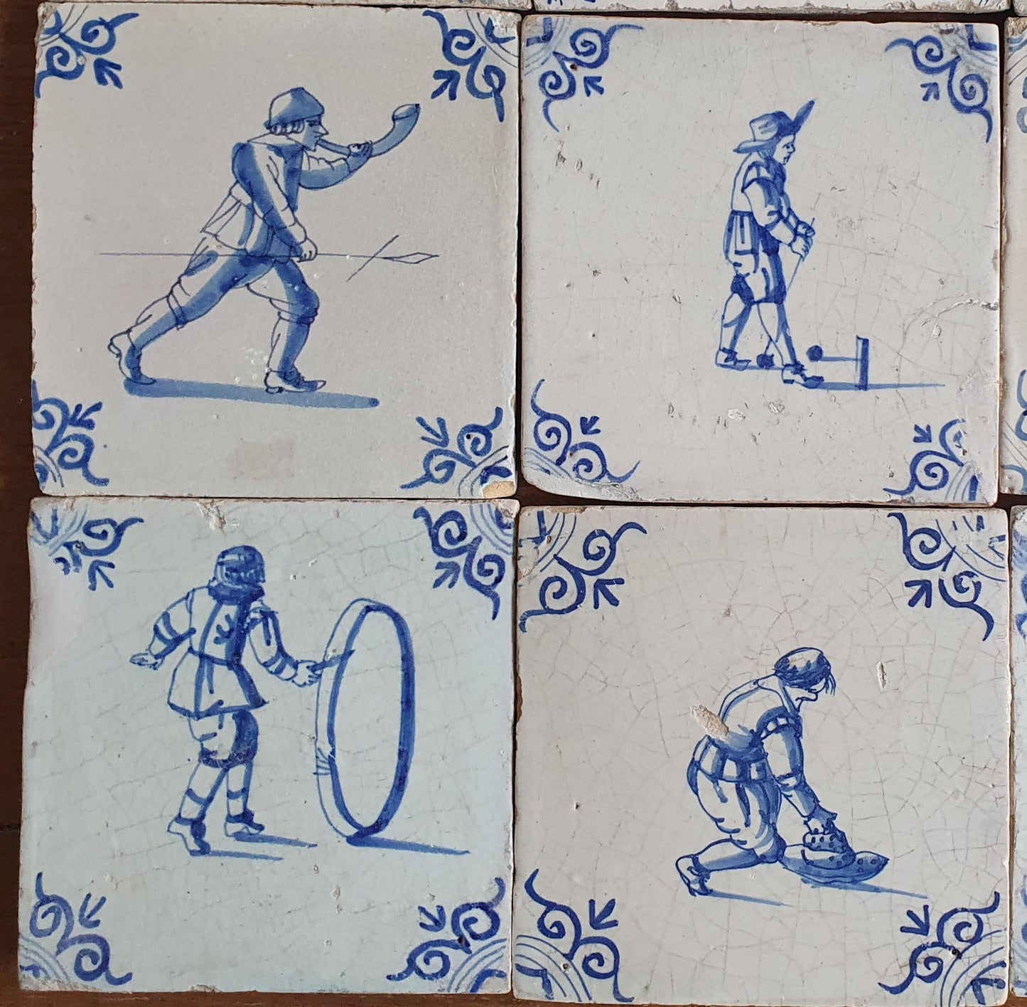 16 x 17th Delft tiles was  made around 1650 and depicts a  chidren,s games