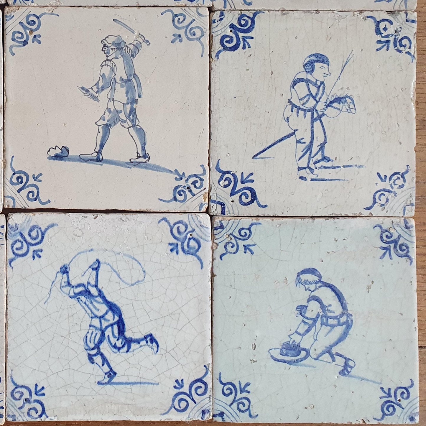 16 x 17th Delft tiles was  made around 1650 and depicts a  chidren,s games