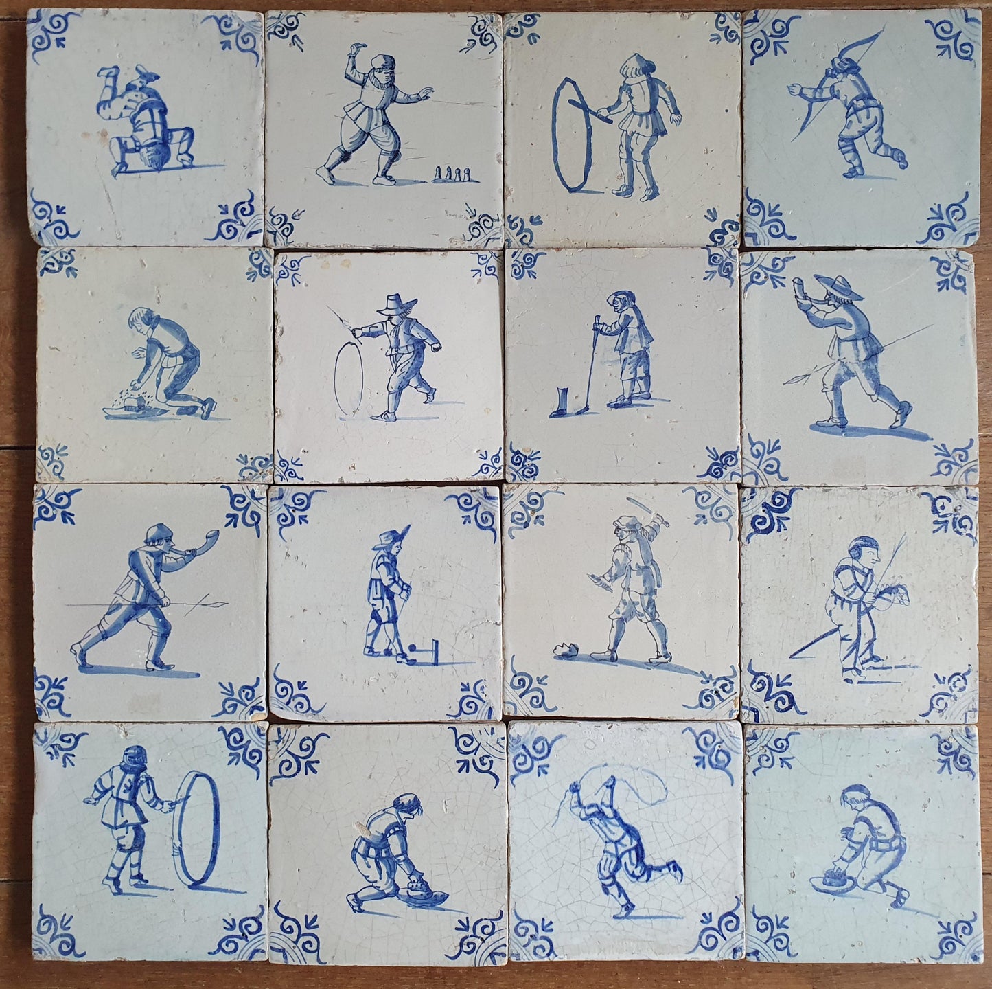 16 x 17th Delft tiles was  made around 1650 and depicts a  chidren,s games