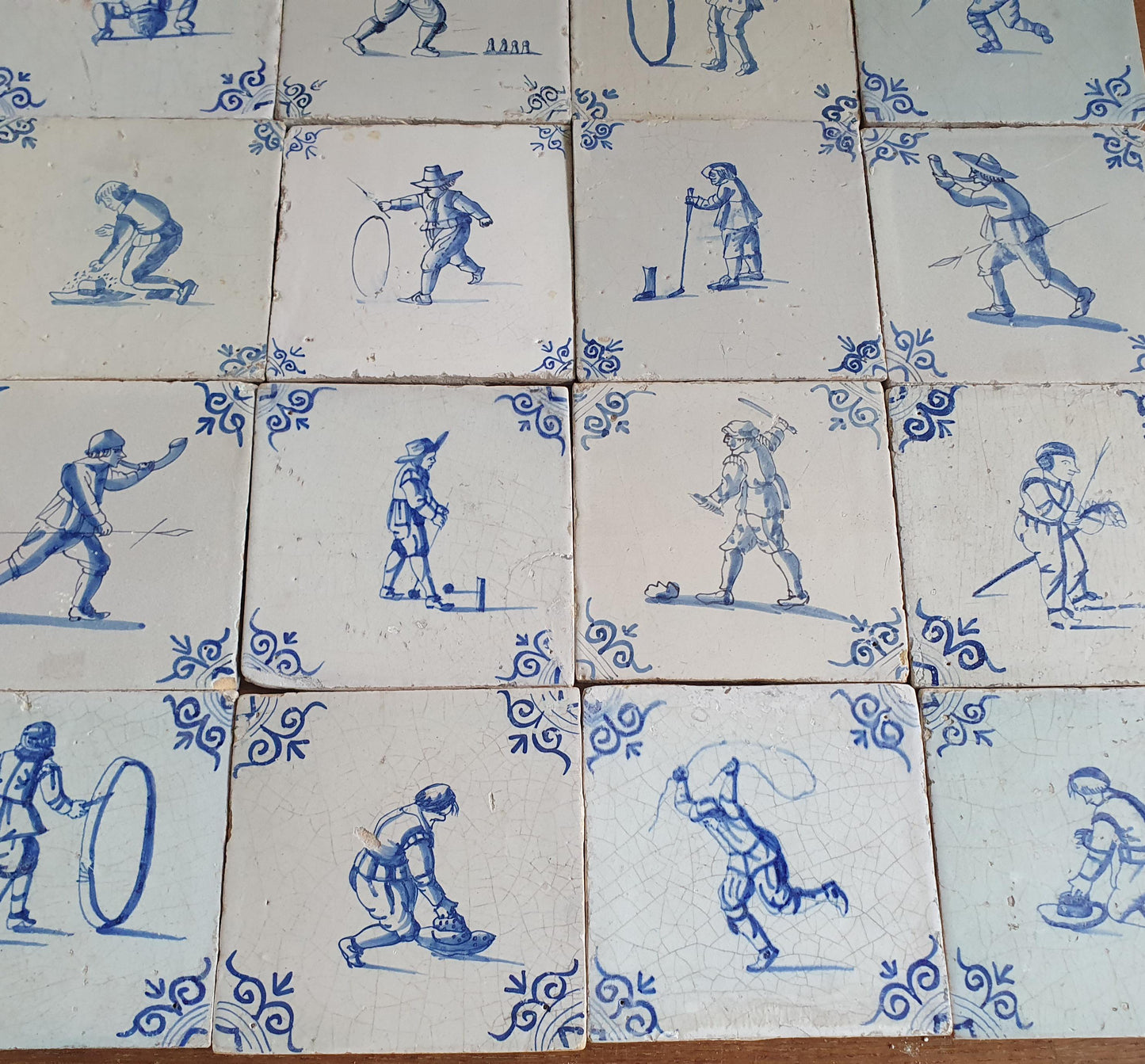 16 x 17th Delft tiles was  made around 1650 and depicts a  chidren,s games