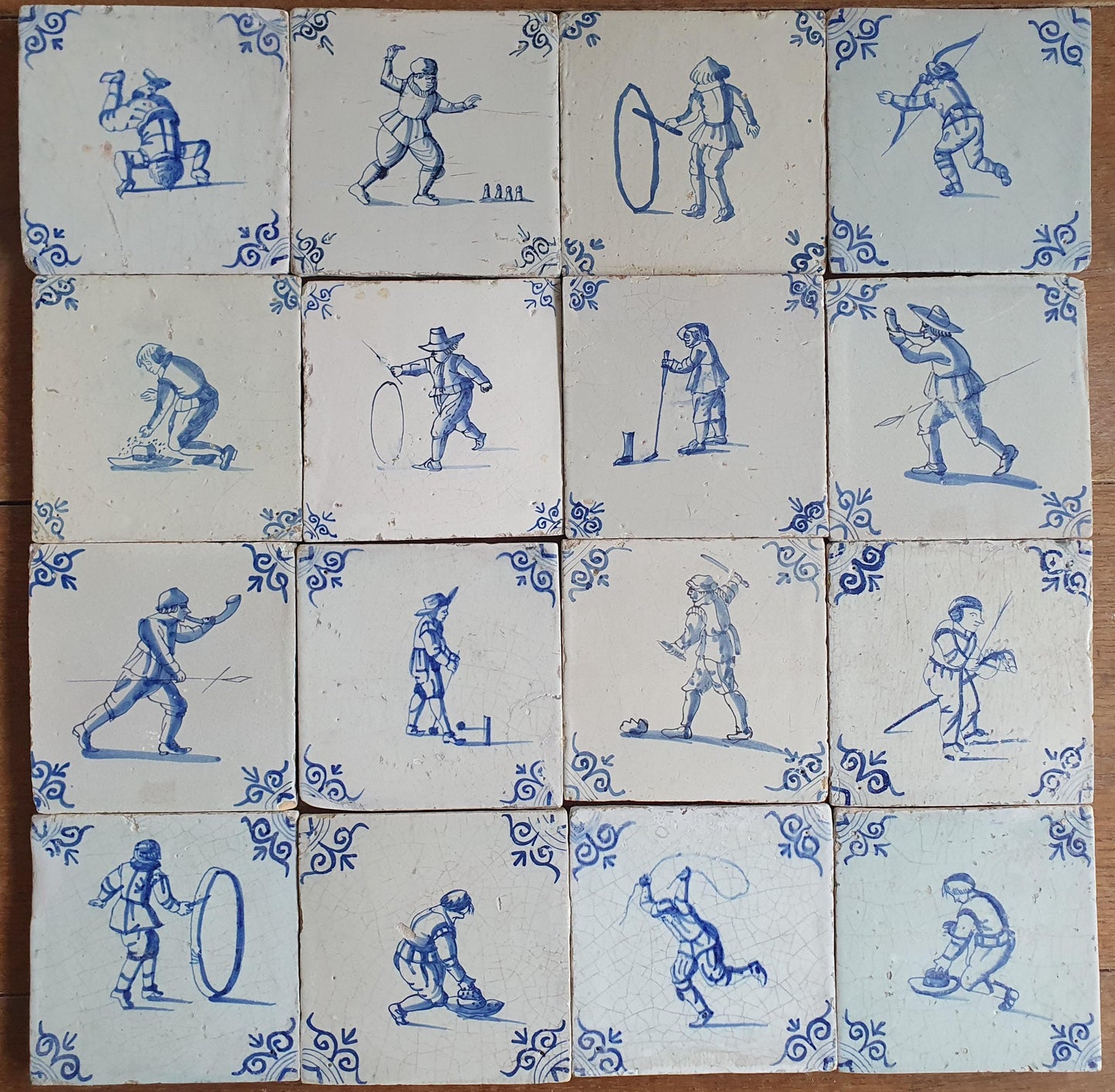 16 x 17th Delft tiles was  made around 1650 and depicts a  chidren,s games