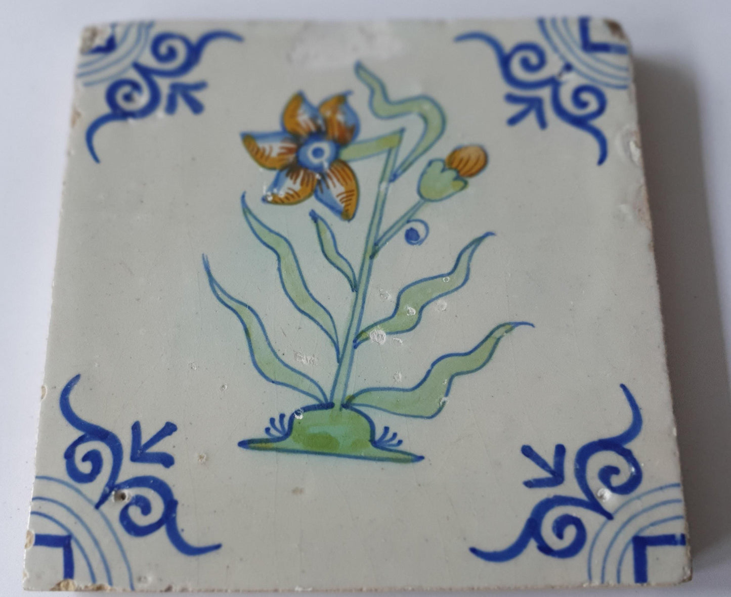 Antique Delft Tile - Polychrome Flower, Oxhead Motifs, c. 1630