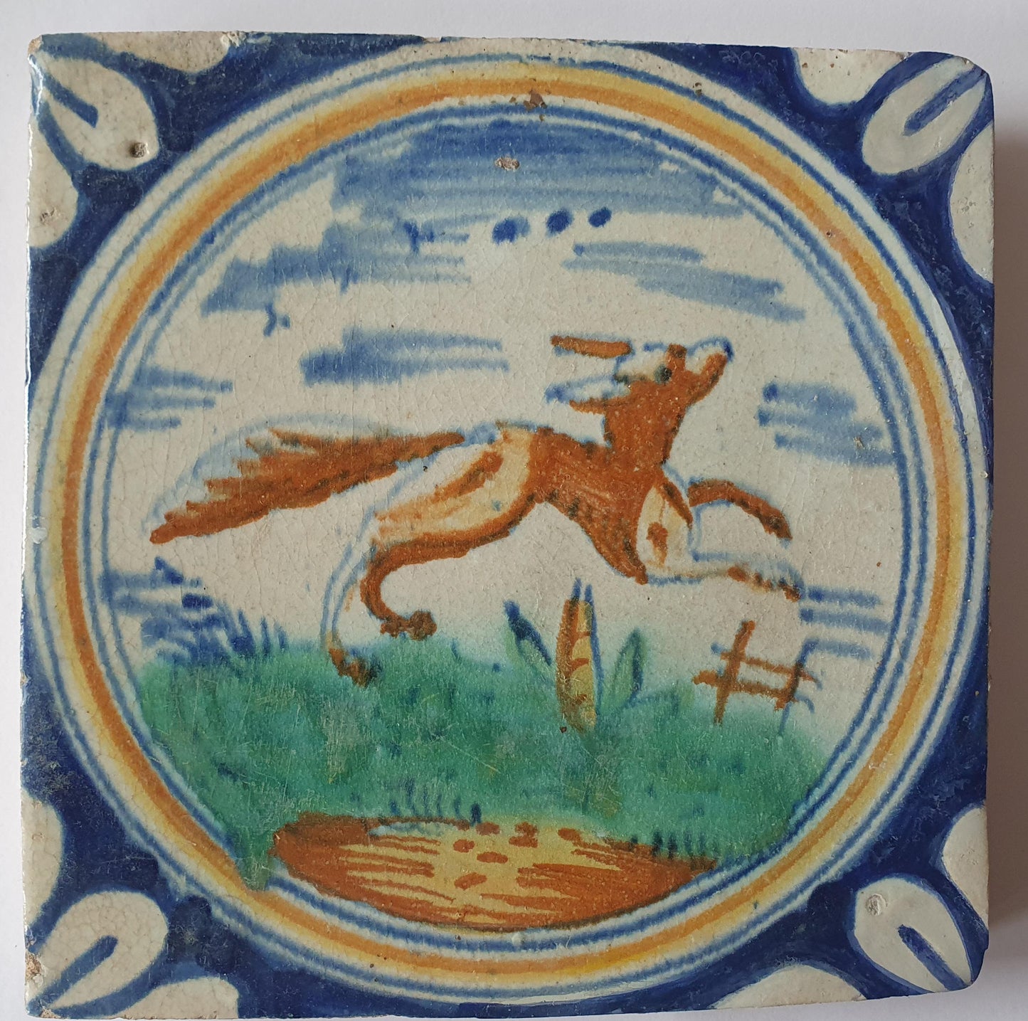 This rare Delft tile with fox .                around 1620