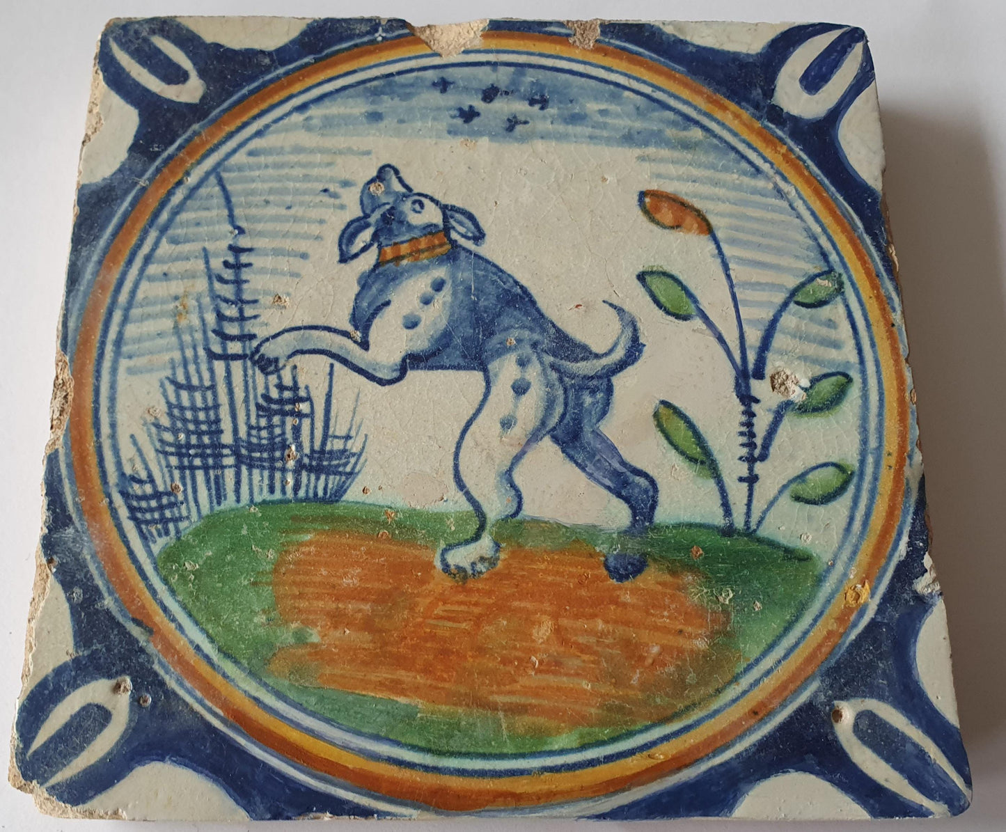 This rare Delft tile with dog .                around 1620