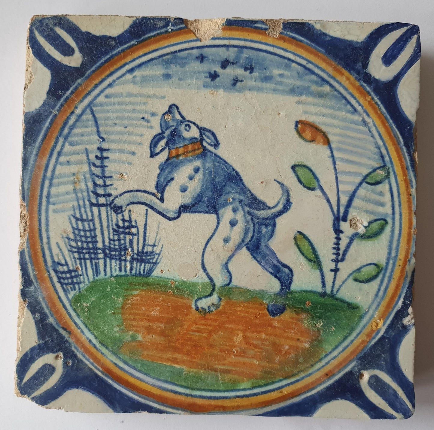 This rare Delft tile with dog .                around 1620
