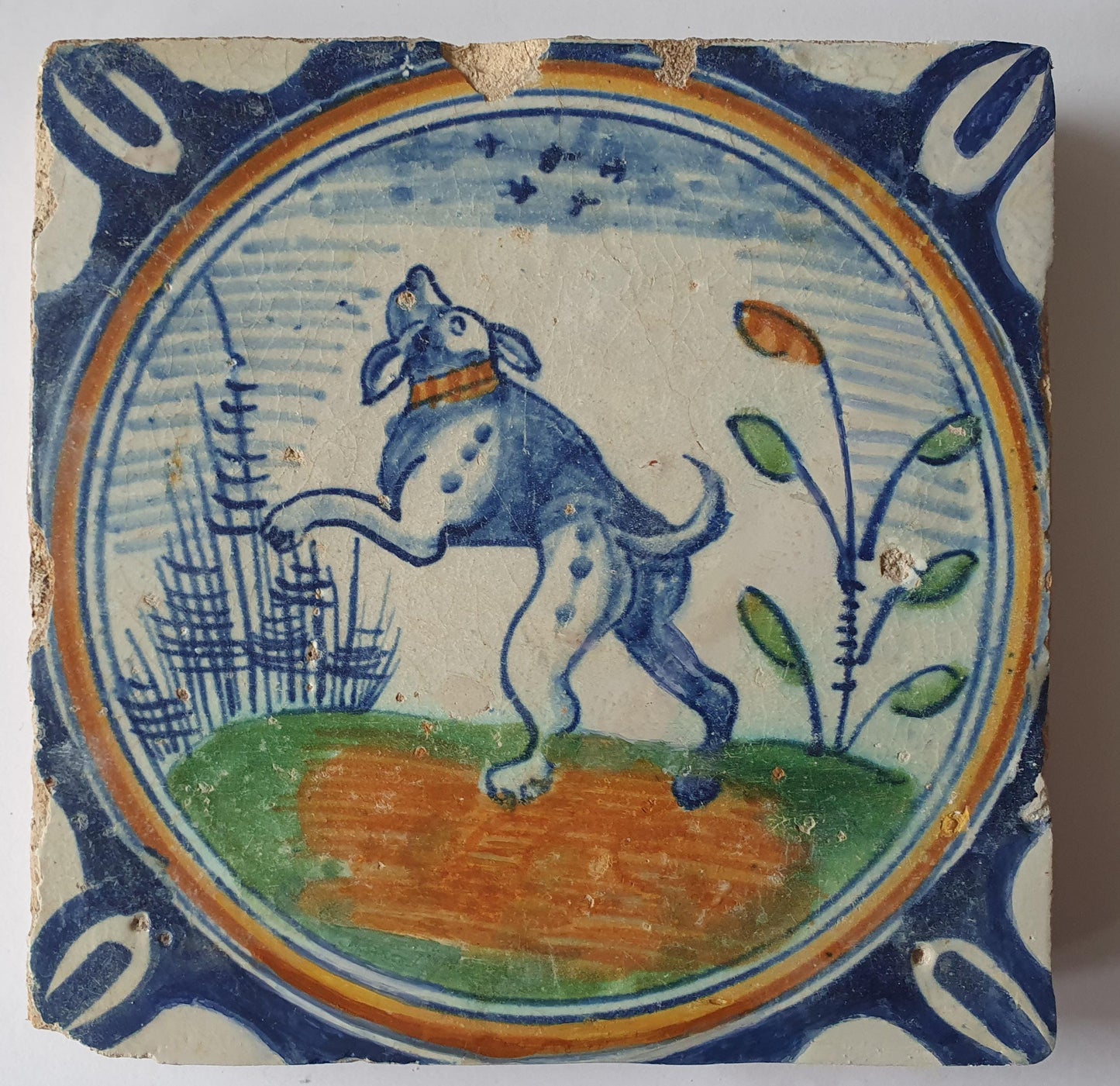 This rare Delft tile with dog .                around 1620