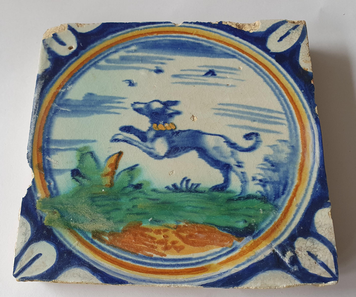 This rare Delft tile with dog .                around 1620