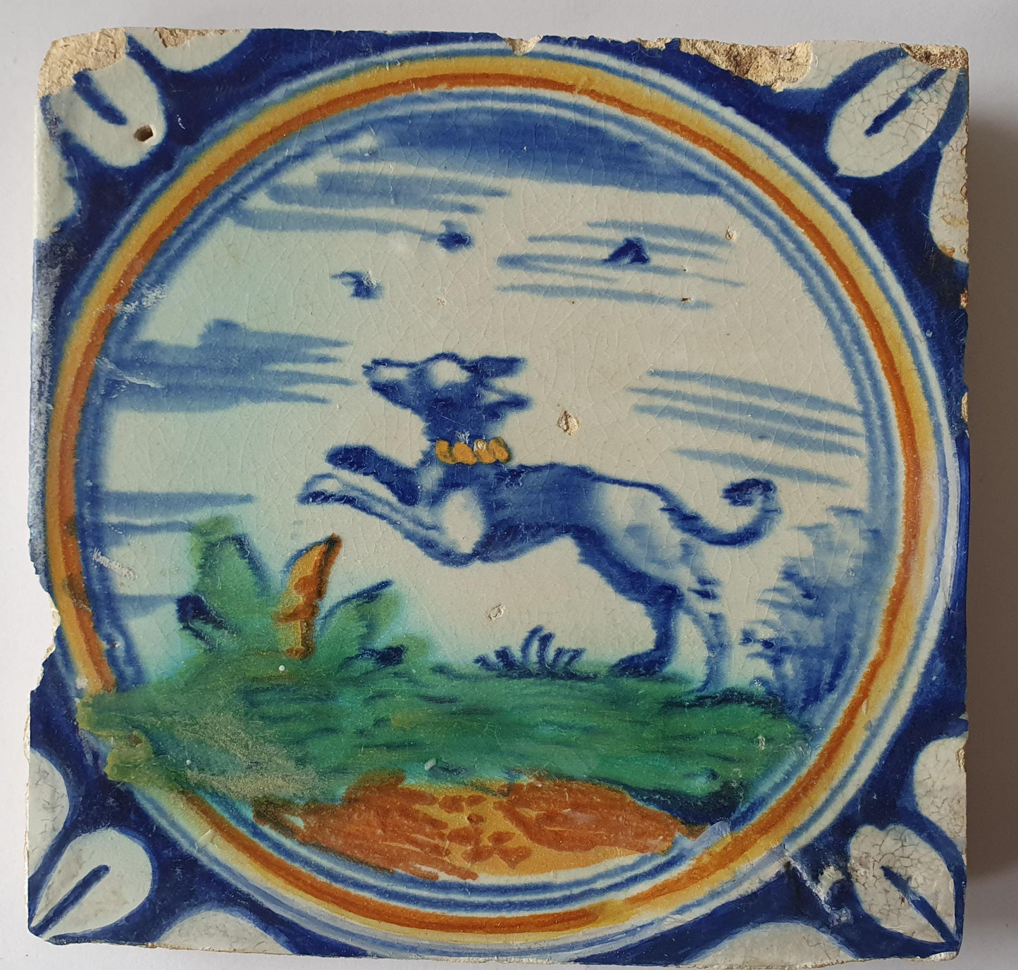 This rare Delft tile with dog .                around 1620
