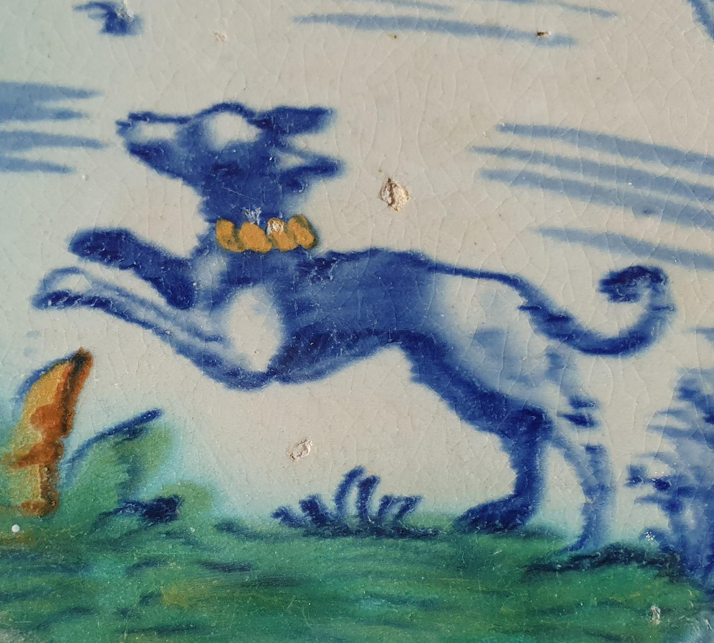 This rare Delft tile with dog .                around 1620