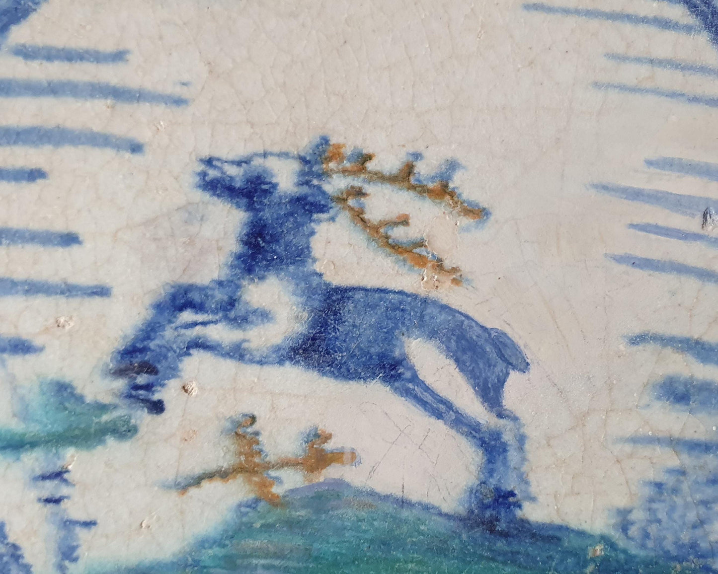 This rare Delft tile with deer .                around 1620