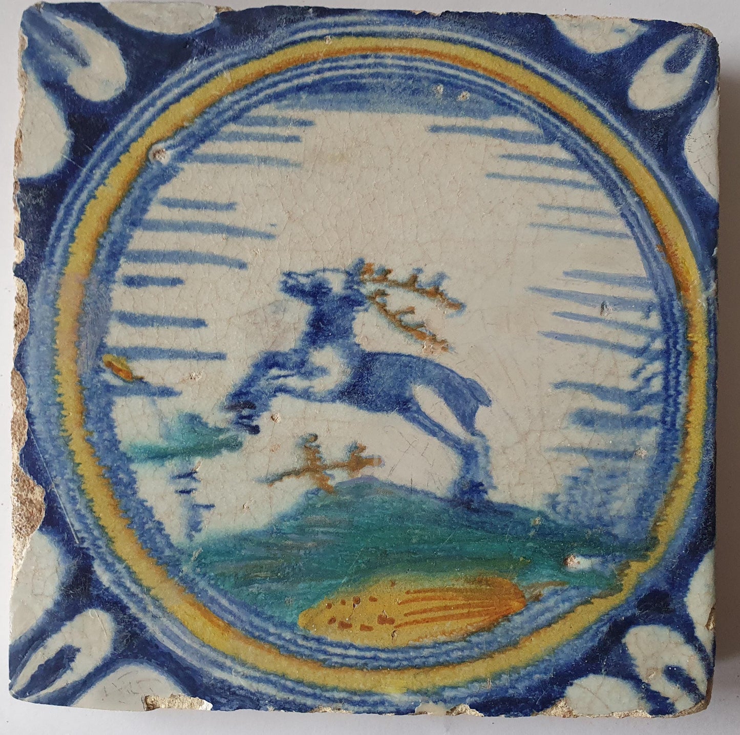 This rare Delft tile with deer .                around 1620