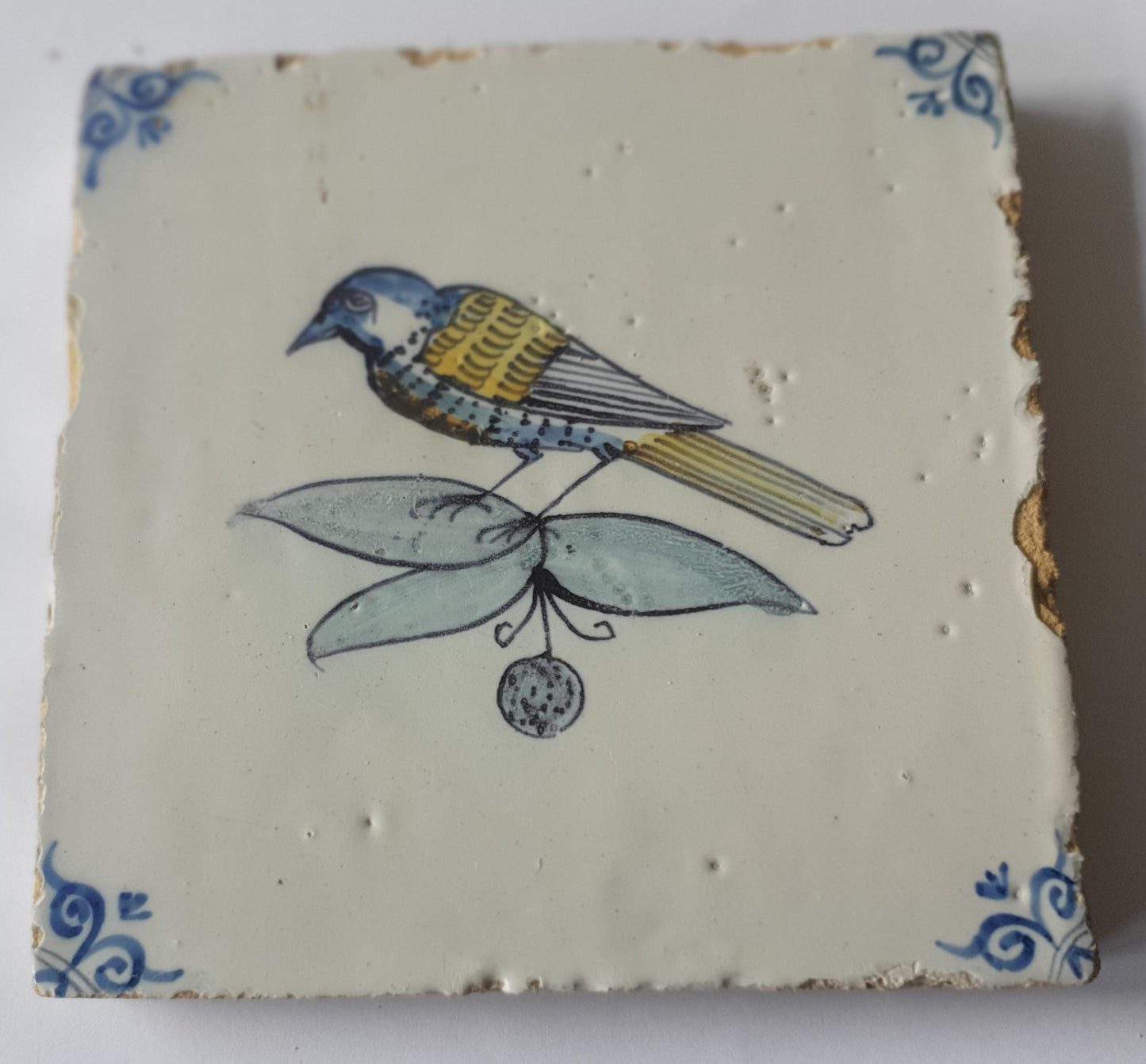 This 17th century Delft tile (c. 1640) depicts a polychrome  bird