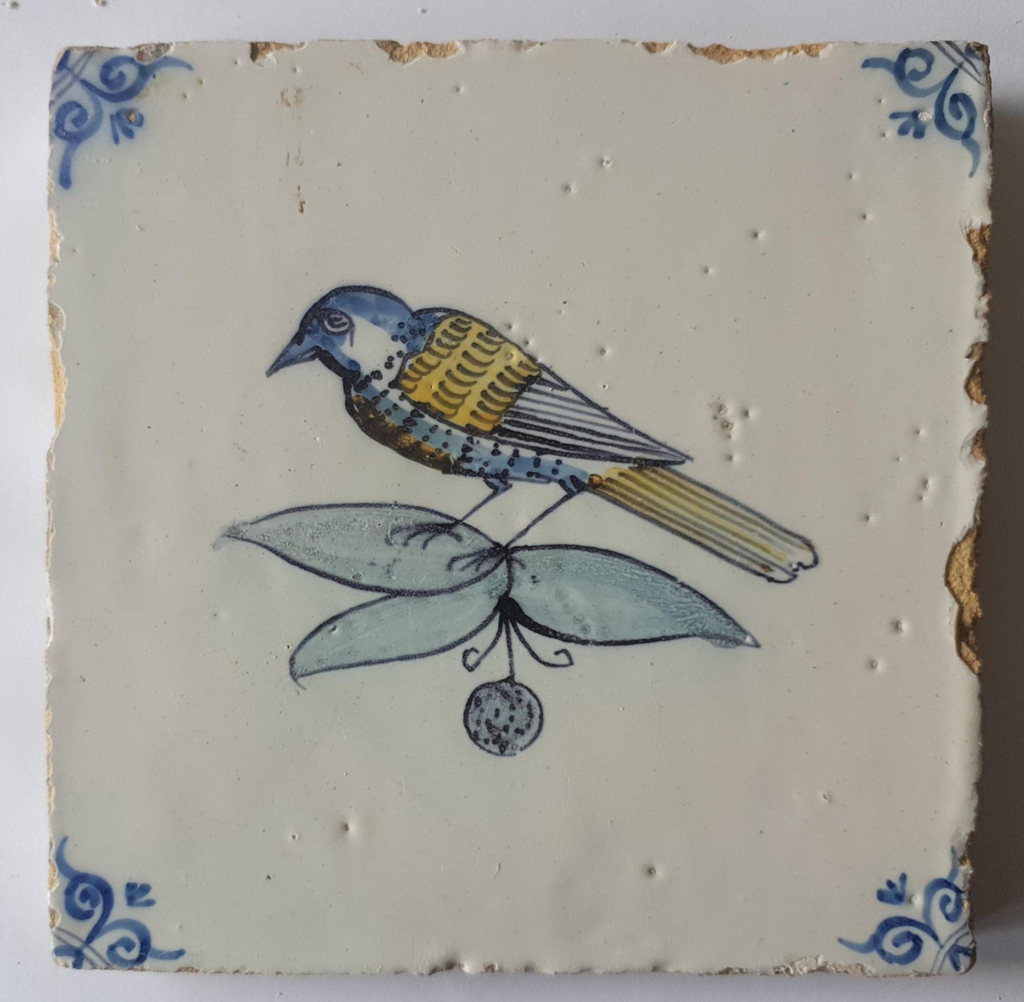 This 17th century Delft tile (c. 1640) depicts a polychrome  bird