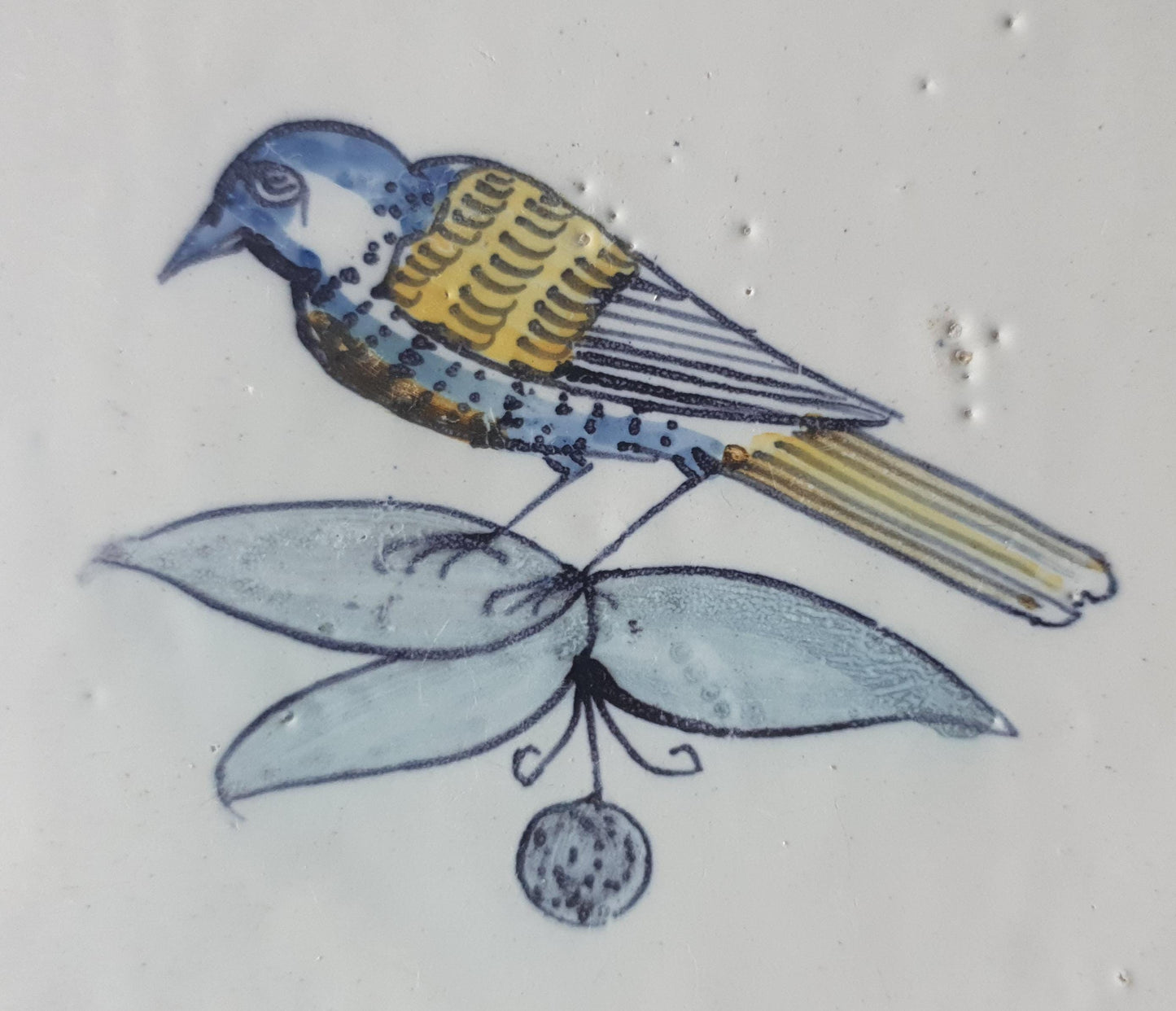 This 17th century Delft tile (c. 1640) depicts a polychrome  bird