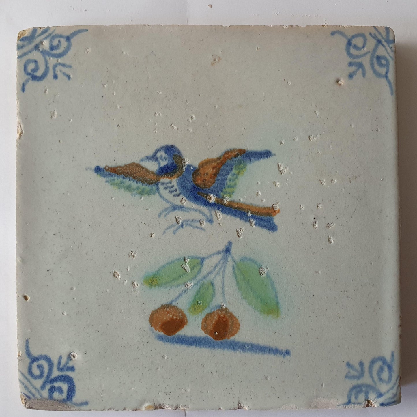 This 17th century Delft tile (c. 1640) depicts a polychrome  bird
