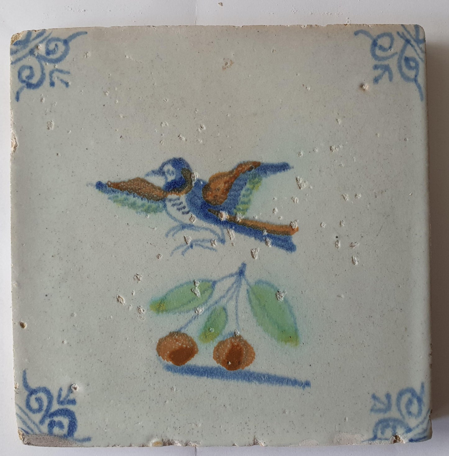 This 17th century Delft tile (c. 1640) depicts a polychrome  bird