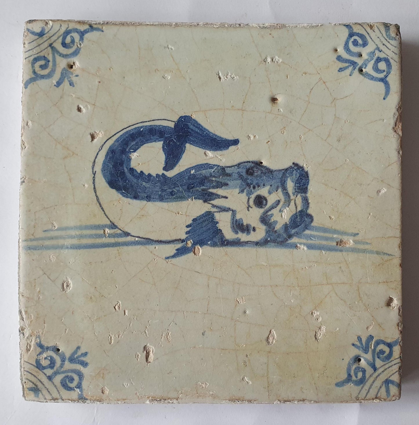 Antique Delft Tile – 17th Century Dutch Fish Design oxhead corner