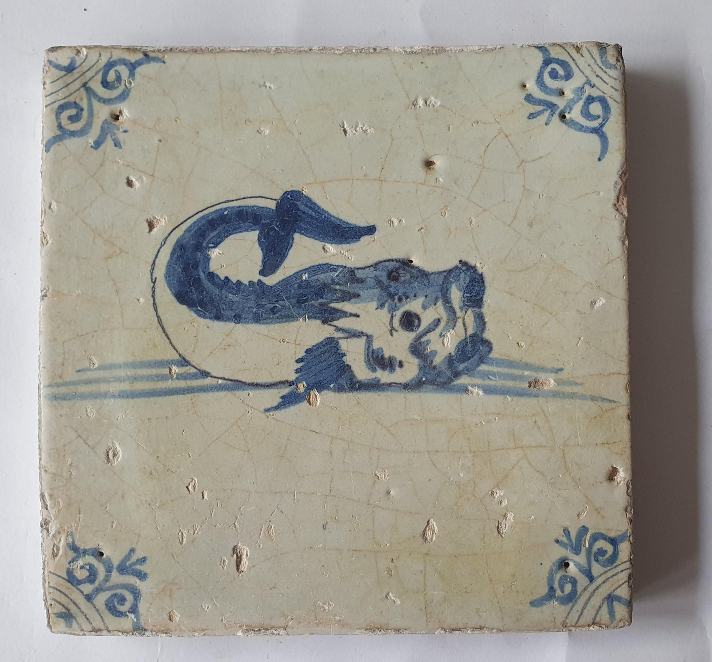 Antique Delft Tile – 17th Century Dutch Fish Design oxhead corner