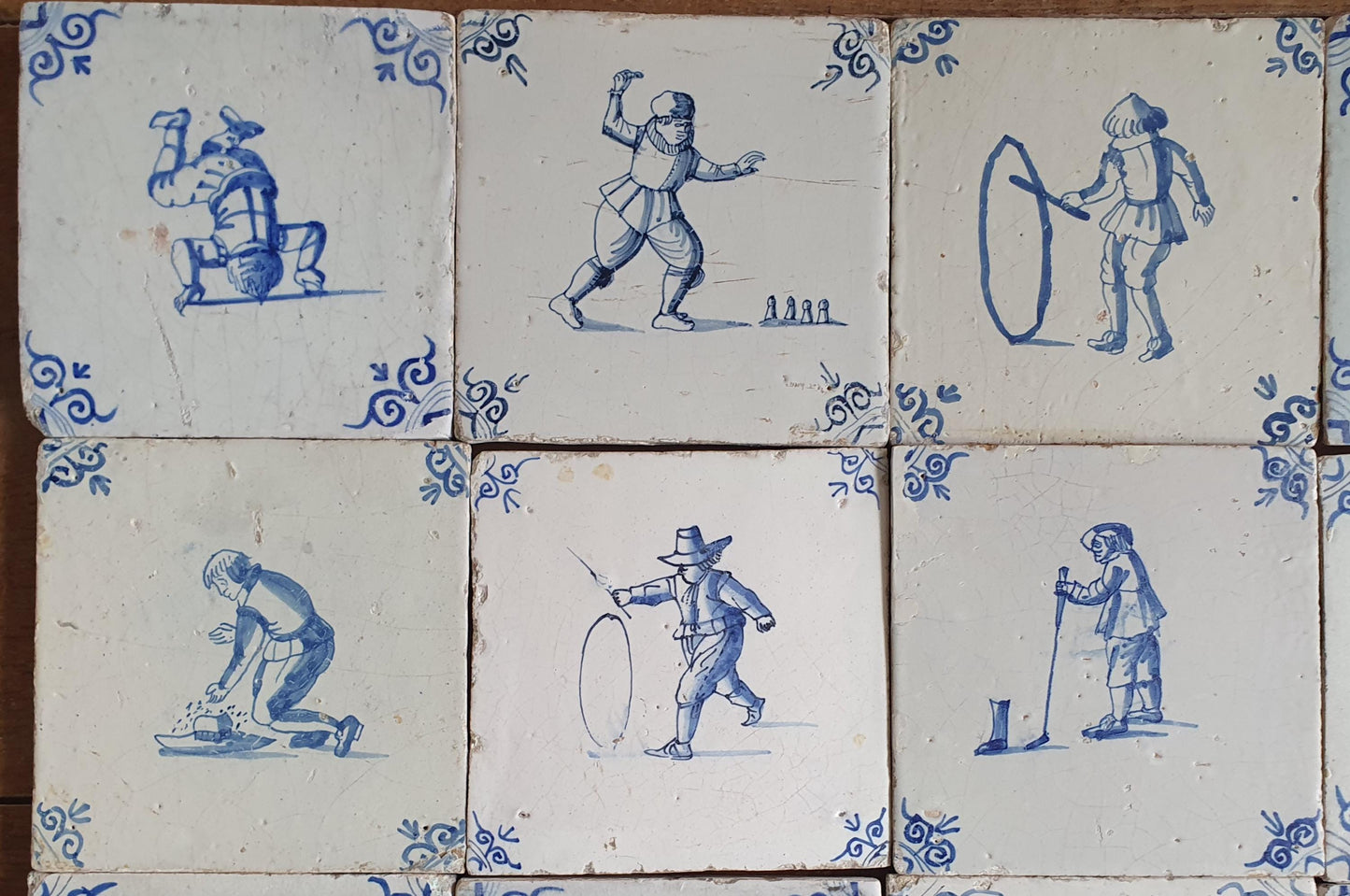 16 x 17th Delft tiles was  made around 1650 and depicts a  chidren,s games