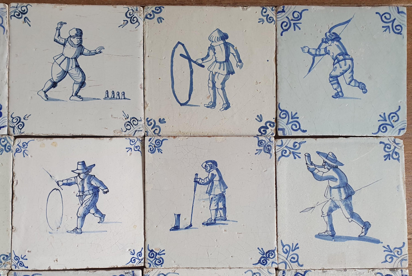 16 x 17th Delft tiles was  made around 1650 and depicts a  chidren,s games