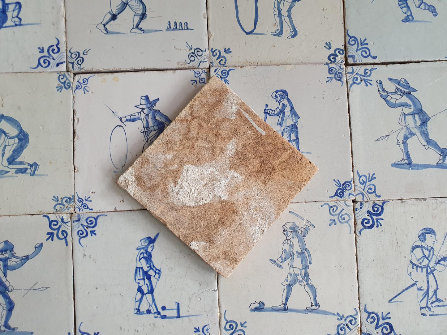 16 x 17th Delft tiles was  made around 1650 and depicts a  chidren,s games